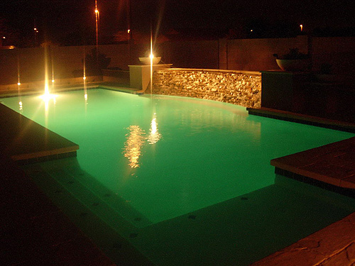 Diving pool with plaster, pots and stepping stone waterfall