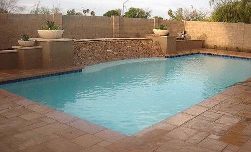 Concrete Swimming Pool with Stepping Stone Flagstone Water Feature